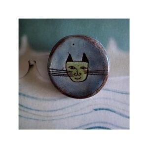 Max Brooch 2. Green face on blue.